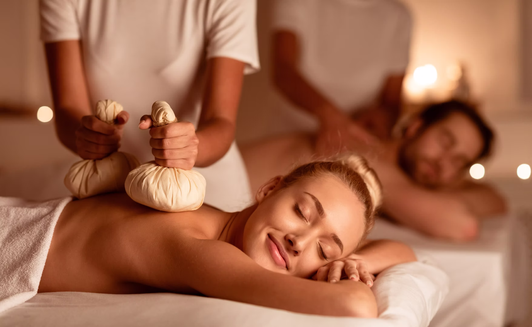 A therapist performing a traditional Thai massage